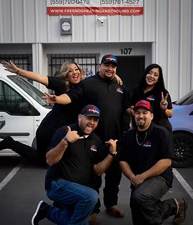 Fresno Heating and Cooling employees standing in front of the company building