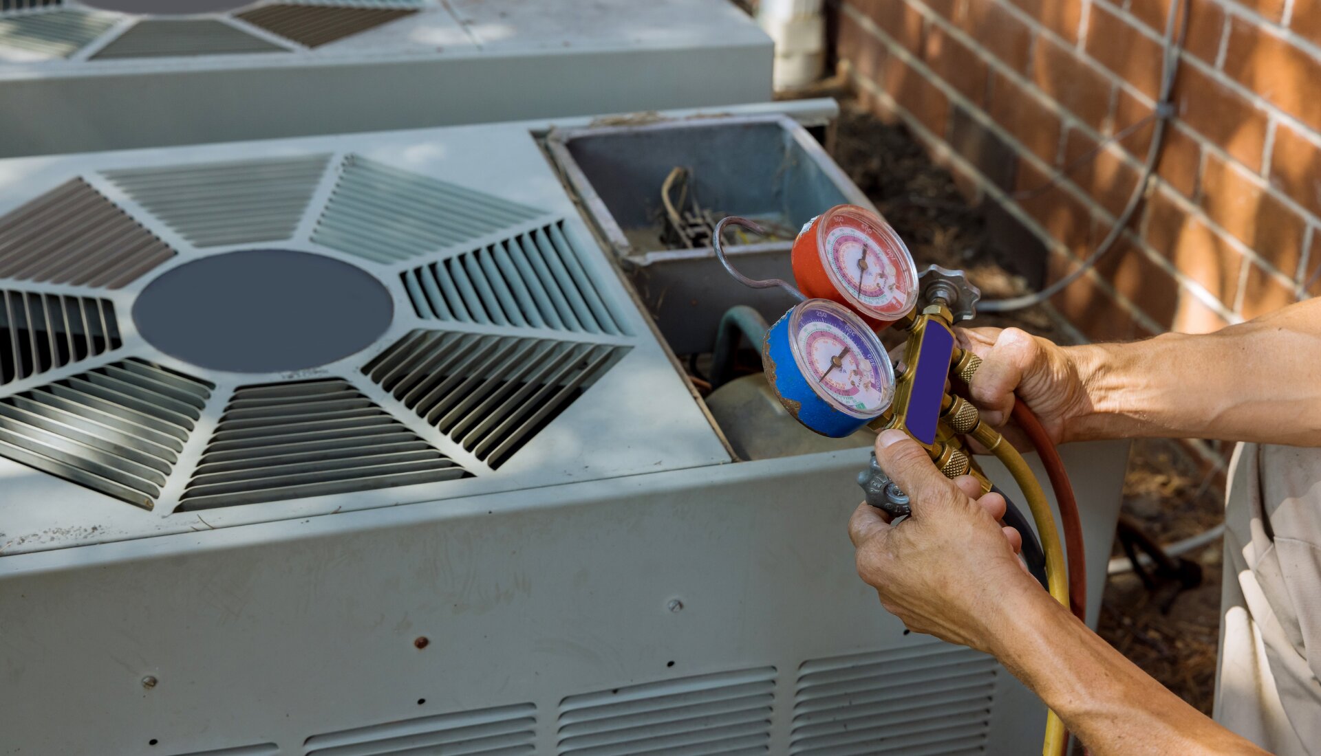 Technician measuring airflow at a ceiling vent in a two-story home